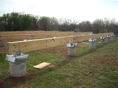 concrete piers for house foundation connected to metal beam|pier and beam foundation photos.